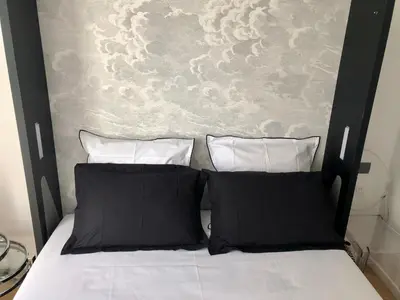Un ou plusieurs lits dans un hébergement de l'établissement Studio confort et design Etoile-Neuilly-La Défense