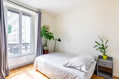 Un ou plusieurs lits dans un hébergement de l'établissement GuestReady - Cosy stay near Jardin du Luxembourg