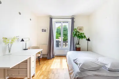Un ou plusieurs lits dans un hébergement de l'établissement GuestReady - Cosy stay near Jardin du Luxembourg