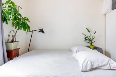 Un ou plusieurs lits dans un hébergement de l'établissement GuestReady - Cosy stay near Jardin du Luxembourg