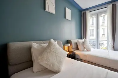 Un ou plusieurs lits dans un hébergement de l'établissement Élégance Urbaine - 2 chambres