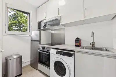 Cuisine ou kitchenette dans l'établissement Appartement élégant et design