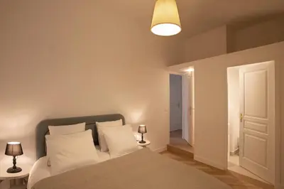 Un ou plusieurs lits dans un hébergement de l'établissement Luxueux Appartement - Centre de Paris