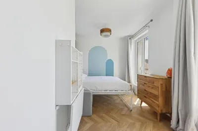 Un ou plusieurs lits dans un hébergement de l'établissement Studio cosy aux portes de Paris