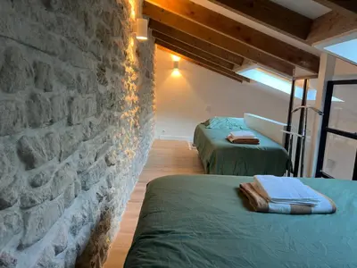Un ou plusieurs lits dans un hébergement de l'établissement Maison Paris