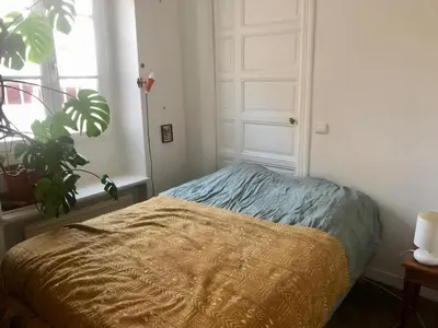Un ou plusieurs lits dans un hébergement de l'établissement Charming Apartment Paris Saint Germain Saint Michel