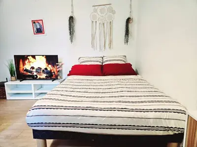 Un ou plusieurs lits dans un hébergement de l'établissement Appartement Paris Mangin
