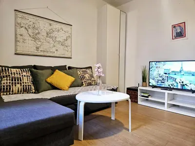 Télévision ou salle de divertissement dans l'établissement Appartement Paris Mangin