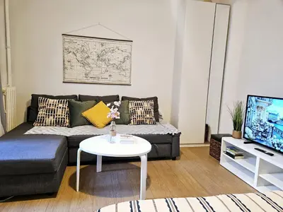 Télévision ou salle de divertissement dans l'établissement Appartement Paris Mangin