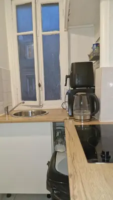 Cuisine ou kitchenette dans l'établissement Guest House Tour Eiffel Paris