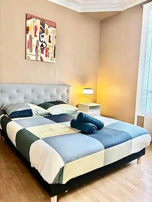Un ou plusieurs lits dans un hébergement de l'établissement Guest House Tour Eiffel Paris