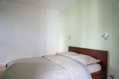 Un ou plusieurs lits dans un hébergement de l'établissement Paris 17 Apartment on Grande Armee Ideal Base for City Explorers