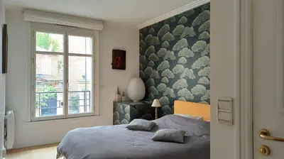 Un ou plusieurs lits dans un hébergement de l'établissement Paris 7 Iconic Apartment in Historic Eiffel Invalides District