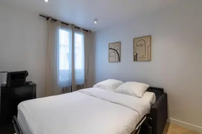 Un ou plusieurs lits dans un hébergement de l'établissement Cozy modern-Paris7-Tour Eiffel-Champs de mars