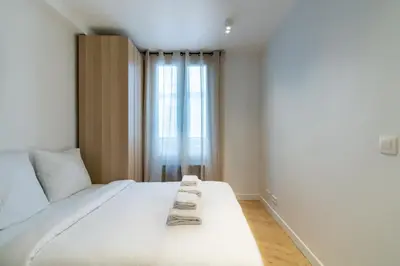Un ou plusieurs lits dans un hébergement de l'établissement Cozy modern-Paris7-Tour Eiffel-Champs de mars