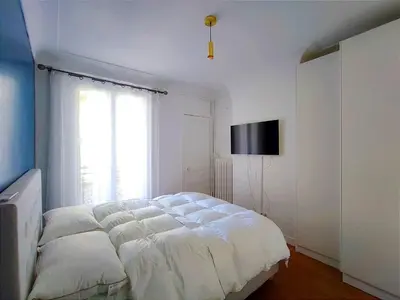 Un ou plusieurs lits dans un hébergement de l'établissement Paris 16 Apartment Near Eiffel Tower and Arc de Triomphe