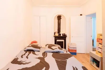 Un ou plusieurs lits dans un hébergement de l'établissement Delight in Montmartre - a true Parisian apartment