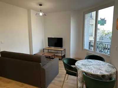 Télévision ou salle de divertissement dans l'établissement Appartement Moderne