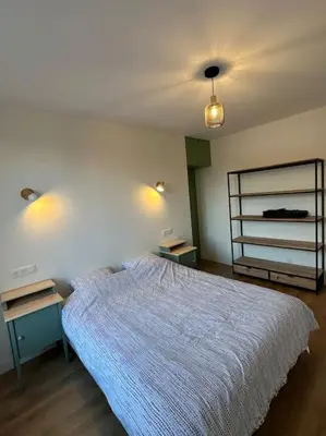 Un ou plusieurs lits dans un hébergement de l'établissement Appartement Moderne