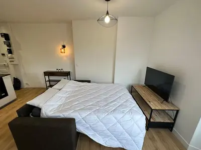 Télévision ou salle de divertissement dans l'établissement Appartement Moderne