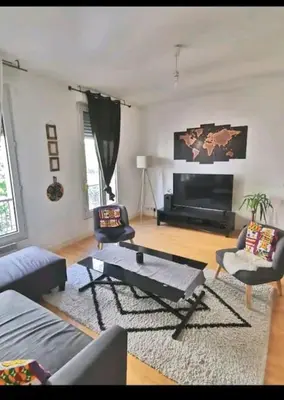 Coin salon dans l'établissement appartement cosy porte de Paris