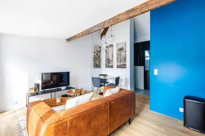 Télévision ou salle de divertissement dans l'établissement GuestReady - Serene stay near Champs de Mars