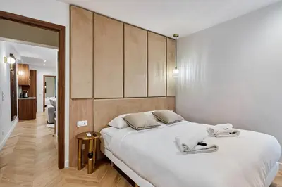Un ou plusieurs lits dans un hébergement de l'établissement Superb Apartment Center of Paris by Studio Prestige
