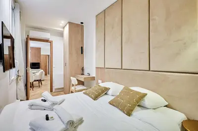 Un ou plusieurs lits dans un hébergement de l'établissement Superb Apartment Center of Paris by Studio Prestige