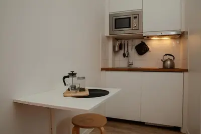Cuisine ou kitchenette dans l'établissement Cosy one bedroom close to Paris & Stade de France