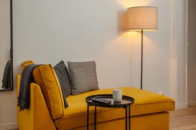 Coin salon dans l'établissement Cosy one bedroom close to Paris & Stade de France