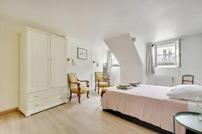 Un ou plusieurs lits dans un hébergement de l'établissement COSY 2 pièces INVALIDES BON MARCHE