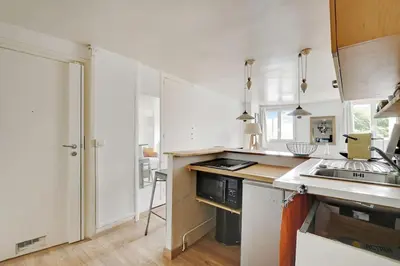 Cuisine ou kitchenette dans l'établissement COSY 2 pièces INVALIDES BON MARCHE