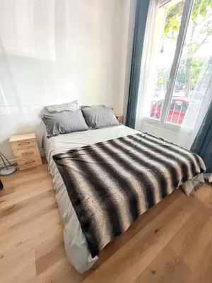 Un ou plusieurs lits dans un hébergement de l'établissement Studio de charme à Montrouge - 20 m² - Internet inclus