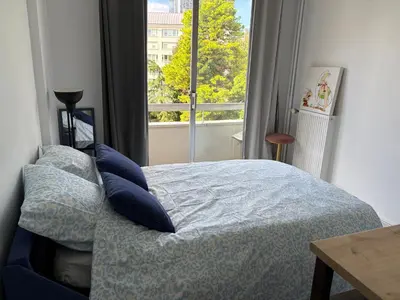 Un ou plusieurs lits dans un hébergement de l'établissement Charm studio nearby La Défense Arena
