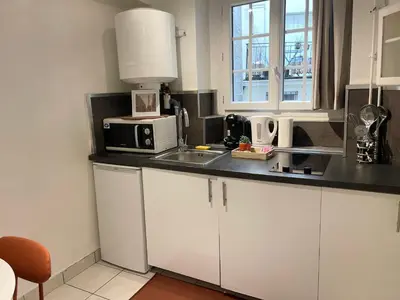 Cuisine ou kitchenette dans l'établissement Le Cocon du Panthéon