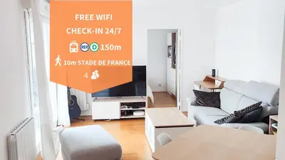 Télévision ou salle de divertissement dans l'établissement Prox Stade France appart 2P Chaleureux