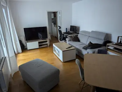 Télévision ou salle de divertissement dans l'établissement Prox Stade France appart 2P Chaleureux