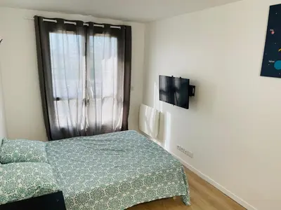 Un ou plusieurs lits dans un hébergement de l'établissement S6 Bel Appartement 10min centre paris stade de France