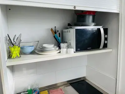 Cuisine ou kitchenette dans l'établissement S6 Bel Appartement 10min centre paris stade de France