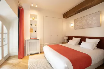 Un ou plusieurs lits dans un hébergement de l'établissement Pick A Flat's Apartements with services in Louvre - Rue des Halles