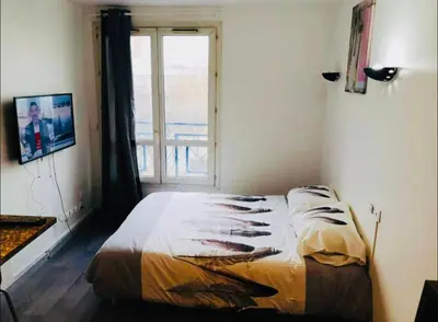 Un ou plusieurs lits dans un hébergement de l'établissement S2 Bel appartement 10min centre Paris stade de France