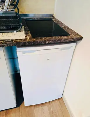 Cuisine ou kitchenette dans l'établissement S2 Bel appartement 10min centre Paris stade de France