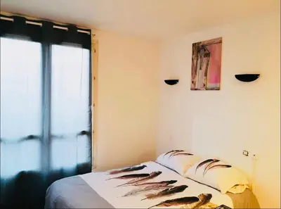 Un ou plusieurs lits dans un hébergement de l'établissement S2 Bel appartement 10min centre Paris stade de France