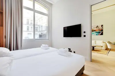 Un ou plusieurs lits dans un hébergement de l'établissement Luxury Apartment - 2BR-4P - GeorgeV-Champs Elysees