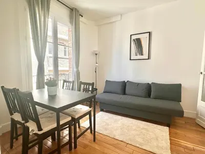 Coin salon dans l'établissement Spacious flat near Montparnasse Bausset 4th