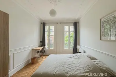 Un ou plusieurs lits dans un hébergement de l'établissement Spacieux appartement de 4 chambres à Paris 14 - Alésia