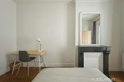 Un ou plusieurs lits dans un hébergement de l'établissement Spacieux appartement de 4 chambres à Paris 14 - Alésia