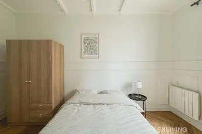 Un ou plusieurs lits dans un hébergement de l'établissement Spacieux appartement de 4 chambres à Paris 14 - Alésia