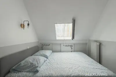 Un ou plusieurs lits dans un hébergement de l'établissement Flexliving - Studio near Eiffel Tower Invalides & Left Bank