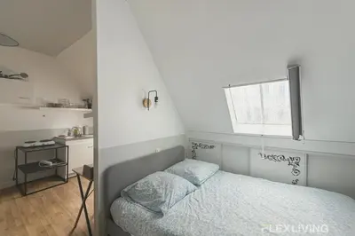 Un ou plusieurs lits dans un hébergement de l'établissement Flexliving - Studio near Eiffel Tower Invalides & Left Bank